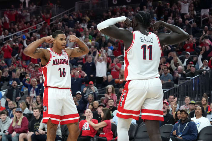 Mar 15, 2024; Las Vegas, NV, USA; Arizona Wildcats center Oumar Ballo (11) and forward Keshad Johnson (16) celebrate in the first half against the Oregon Ducks at T-Mobile Arena.